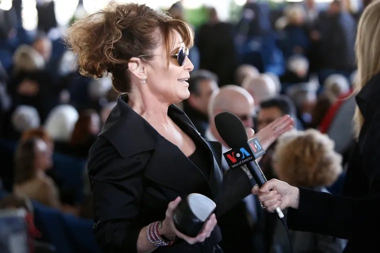 Former Alaska Governor Sarah Palin gives a media interview before the start of a funeral service for Rev. Billy Graham at the Billy Graham Library on March 2, 2018 in Charlotte, North Carolina.  (Brian Blanco/Getty Images/TNS)