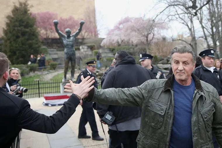 Actor Sylvester Stallone greets fans after visiting the Rocky statue outside the Philadelphia Museum of Art on Friday, April 6, 2018. Stallone, who is in town filming Creed II, visited the statue to rededicate a plaque at its base.