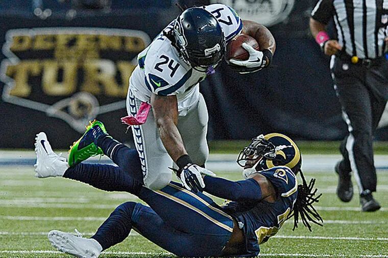 Seahawks running back Marshawn Lynch is tackled by Rams cornerback Janoris Jenkins. (Jeff Curry/USA Today Sports)