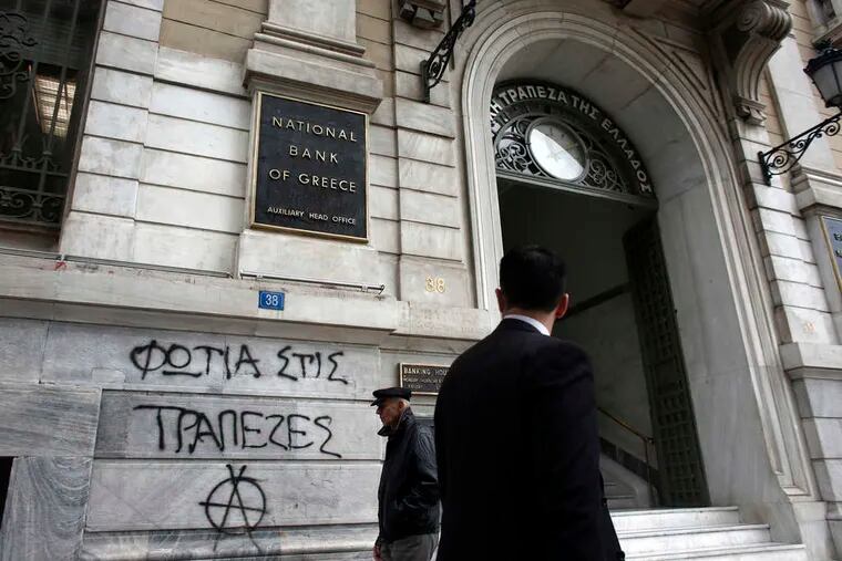Graffiti in Athens reads, &quot;Burn the banks.&quot; Negotiations are deadlocked over bailout aid for Greece.