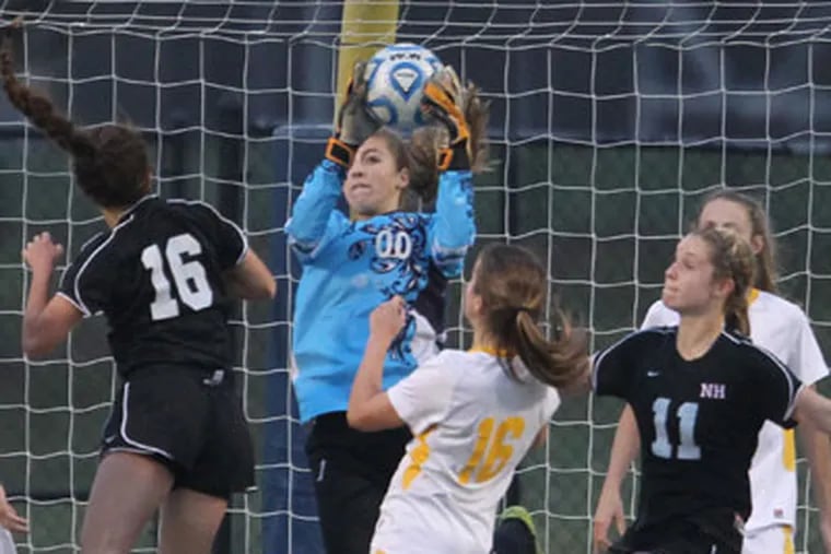 Moorestown's Carly Blesssing makes one of dozens of saves despite a 3-1 to Northern Highlands December 2, 2012. ( DAVID SWANSON / Staff Photographer )