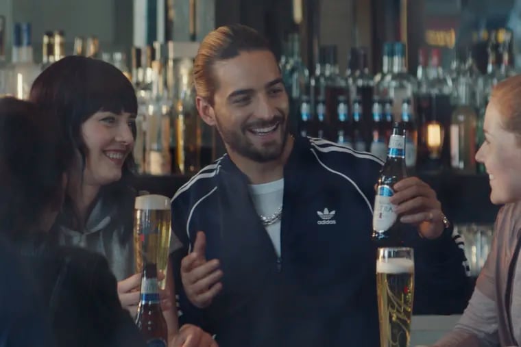 Some beer commercials made before social distancing and the age of the coronovirus seem dated. This 2019 Michelob ULTRA spot features the Colombian singer, Maluma, center. (Michelob ULTRA via AP)