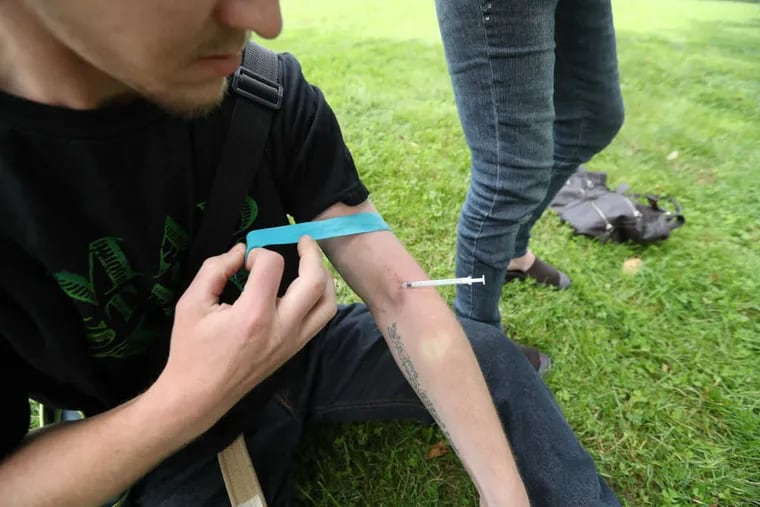 Dylan, who would not give his last name, injects himself outside the McPherson Square library, whose staffers took it up themselves to learn how to give the overdose antidote Narcan.