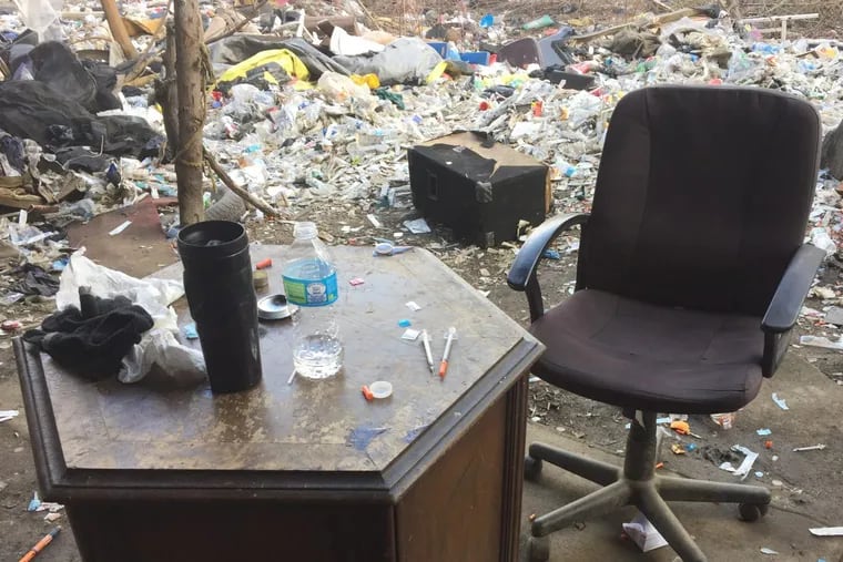 A nightstand doubled as a drug desk for heroin addicts along the gulch on Gurney Street.