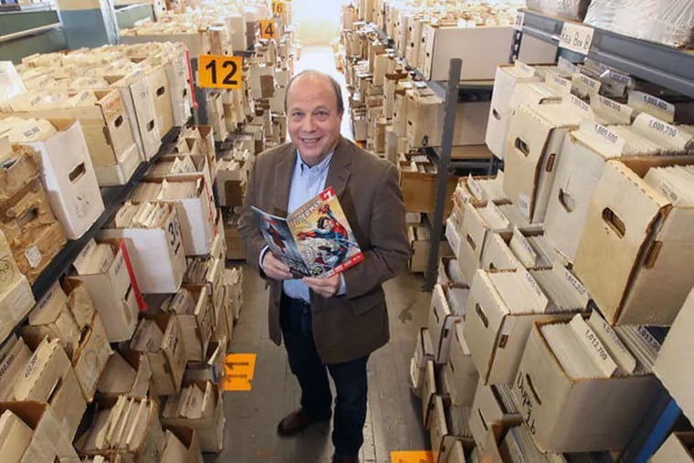 Jim Drucker stands among some of the 749,000 comics he has in inventory at New Kadia Comics in Norristown. ( Michael Bryant / Staff Photographer )