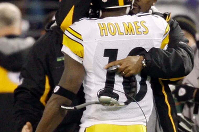 Santonio Holmes gets a hug from coach Mike Tomlin after TD.