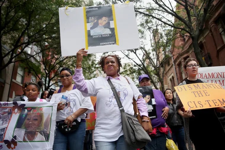 Diane Smith, aunt of Shantee Tucker, holds up a poster in remembrance of Tucker during the eighth annual Philly Trans March in Center City Philadelphia on Saturday, Oct. 6, 2018. Tucker was a trans woman killed near Hunting Park in September.