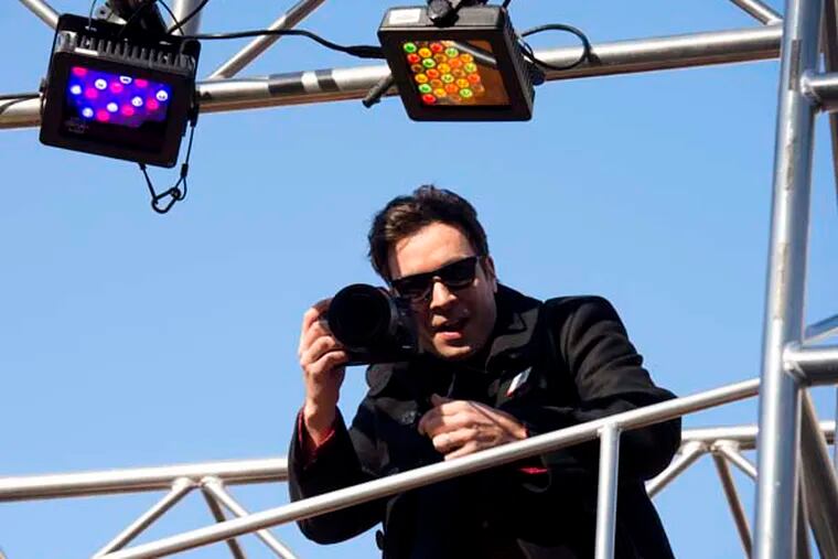 Jimmy Fallon rides a float in the Macy's Thanksgiving Day Parade in New York, Thursday, Nov. 22, 2012. (AP Photo/Charles Sykes)
