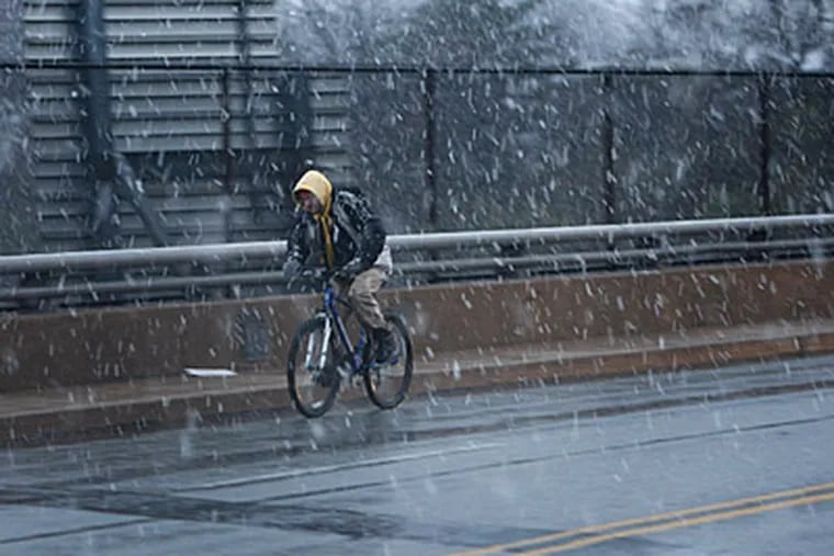 A bicyclist pedals over I-95 on Chichester Avenue in Chichester Township. (Michael S. Wirtz / Staff)