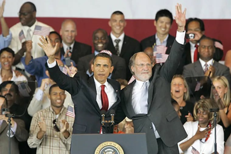 President Barack Obama, left, and New Jersey Gov. Jon S. Corzine wave during a campaign appearance for Corzine at the PNC Bank Arts Center in Holmdel, N.J. today.(AP Photo/Mike Derer)