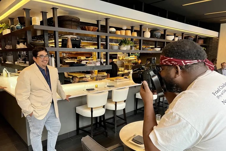 Chef Reuben Harley, who is also a photographer, gets chef Jose Garces to pose at Volvér before dinner service on Sept. 21.