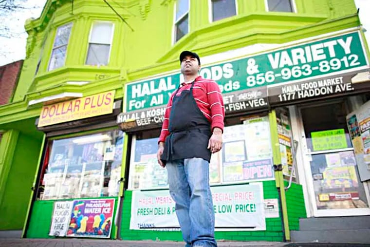 Mohammed Uddin, who owns Halal Meats & Grill on Haddon Avenue, said the new county force has cleared the sidewalk in front of his store of men who used to gather in groups and sometimes panhandle and drink, Friday December 27, 2013. ( DAVID SWANSON / Staff Photographer )