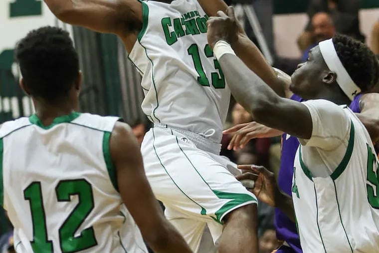 Camden Catholic's Courtney Cubbage looks for a teammate in a big win over rival Camden. on Feb. 2.