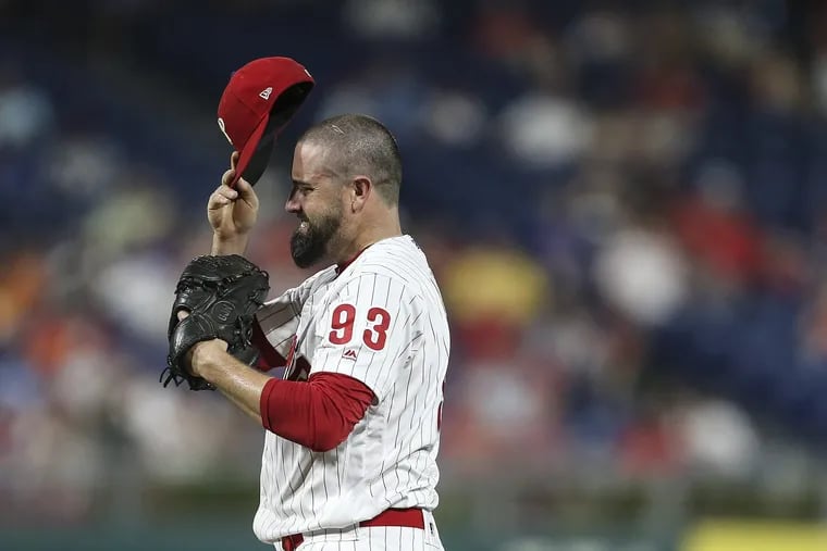 Pat Neshek grimaces after giving up a two-run home run to Anthony Rendon in the ninth, which gave the Nationals the lead and eventually the win on Tuesday at Citizens Bank Park.