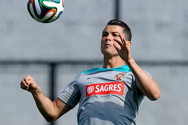 Cristiano Ronaldo controls the ball during a training session of Portugal in Campinas, Brazil, Thursday, June 19, 2014. Portugal plays in group G of the Brazil 2014 soccer World Cup. (Paulo Duarte/AP)