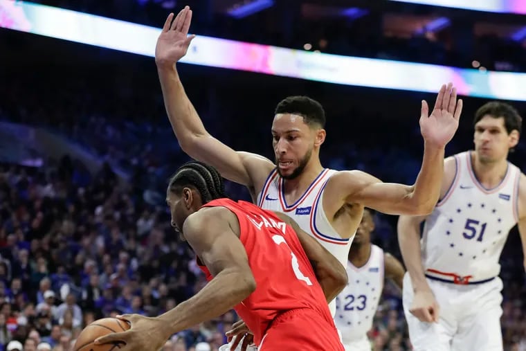 Sixers guard Ben Simmons defends  Raptors star Kawhi Leonard during the Eastern Conference semifinals.
