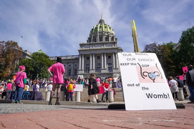People gather outside the Pennsylvania State Capitol Building for the Bans Off Our Bodies rally in Harrisburg, Pennsylvania, October 2, 2021.
