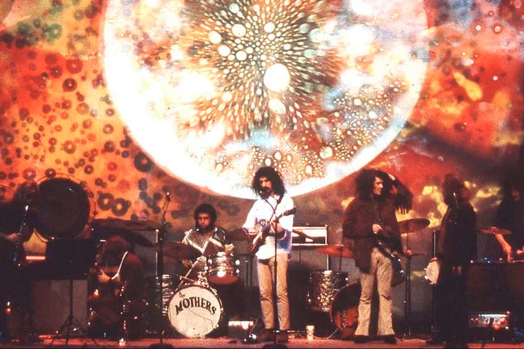 A Joshua Light Show backs up Frank Zappa and the Mothers of Invention.