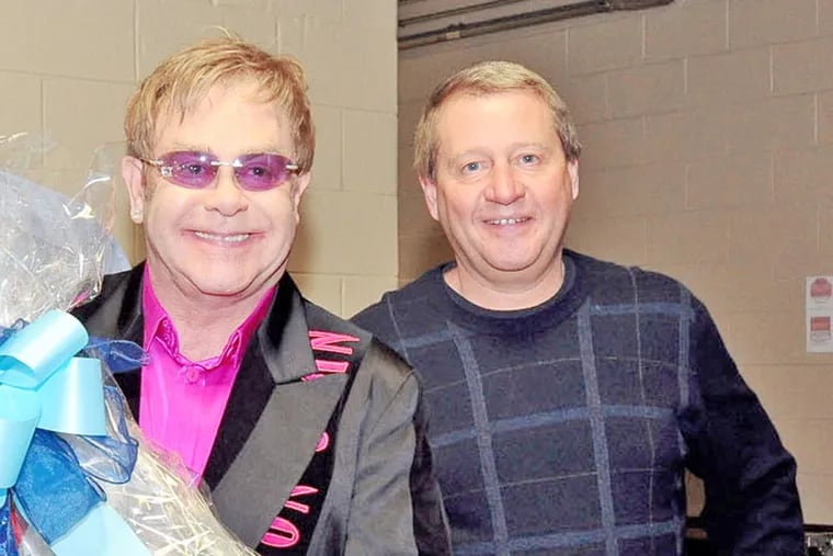 Elton John and Comcast-Spectacor president Peter Luukko.