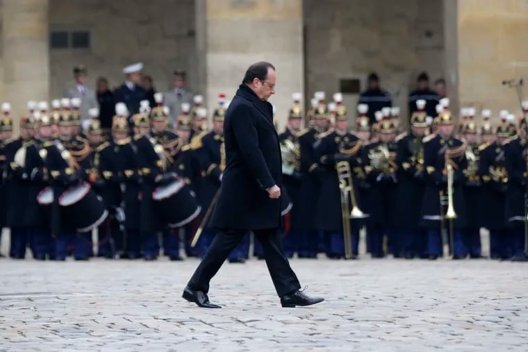 French President Francois Hollande attends a ceremony in the courtyard of Paris' Invalides national monument.