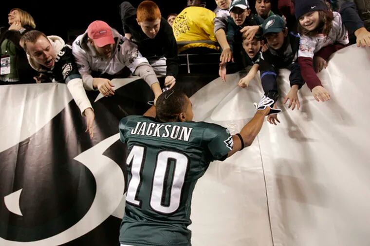 Rookie DeSean Jackson celebrates with fans after the Eagles beat the Cowboys, 44-6, and clinched a playoff spot.