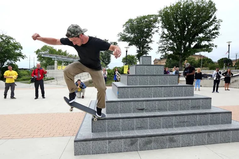 Chris Mathis of Philadelphia skates the pyramid half of the sculpture. Even before the work was unveiled, bikers and skateboarders had partaken of the art. (DAVID SWANSON / Staff Photographer)