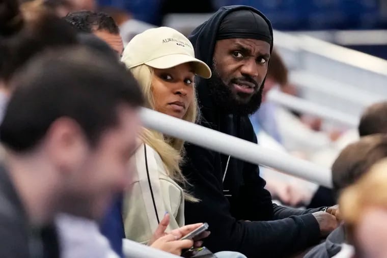 LeBron James, right, and his wife Savannah James watch their son Bronny James during the 2024 NBA Draft Combine 5-on-5 basketball game on Wednesday.