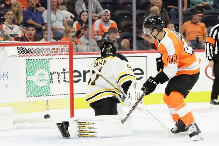Flyers center Morgan Frost tries to score during a first-period power play against Boston Bruins goalie Jaroslav Halak in a preseason game Thursday. Frost's deflection went off the post, and Halak robbed him on the rebound.