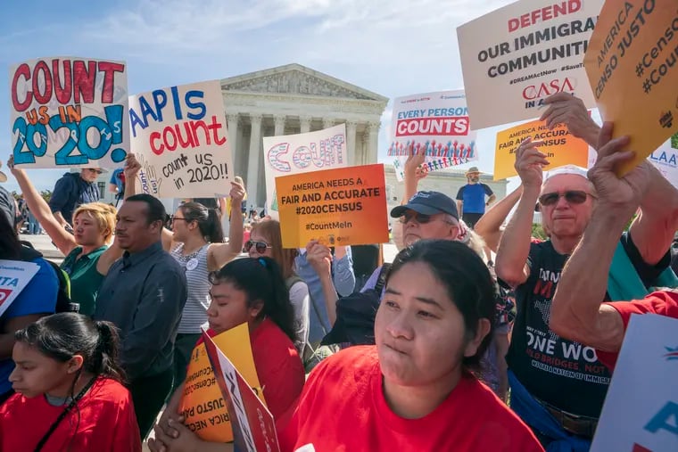 Immigration activists rally outside the Supreme Court as the justices hear arguments over the Trump administration's plan to ask about citizenship on the 2020 census, in Washington, Tuesday, April 23, 2019. Critics say the citizenship question on the census will inhibit responses from immigrant-heavy communities that are worried the information will be used to target them for possible deportation. (AP Photo/J. Scott Applewhite)