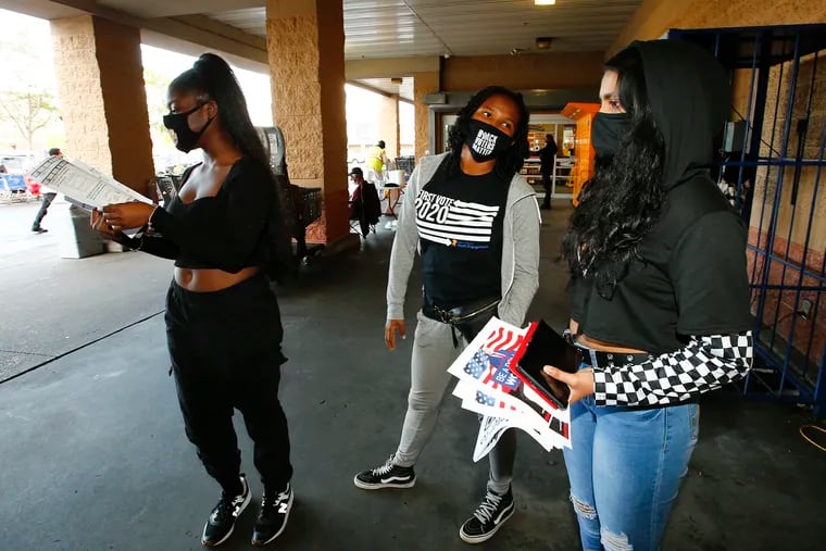 Students (from left to right): Samyah Smalley, Sheyla Street and Gauri Nair wait to help register voters at the ShopRite of Parkside on Saturday, September 26, 2020.  The students are part of the group Philly Youth Vote.