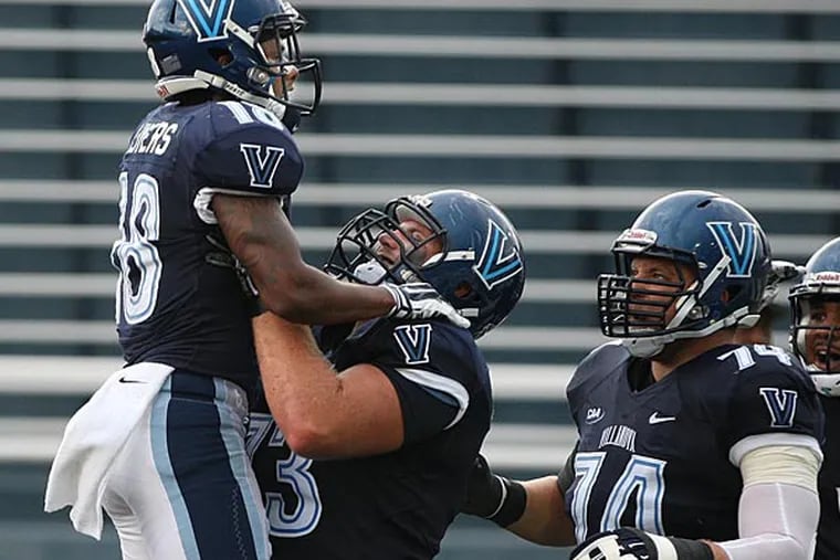 Villanova's Poppy Livers gets lifted in the air by teammate Ross Hall after Livers scored on a pass play. (Michael Bryant/Staff Photographer)