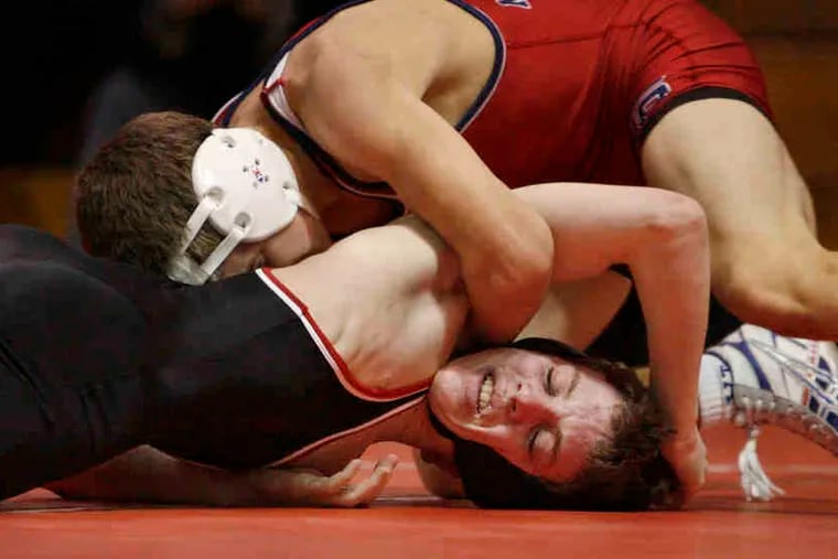 Wrestling at 112 pounds in 2008, Washington Township's Chalie Huff (top) tried to turn Cherry Hill East's Andrew Lowenstern.