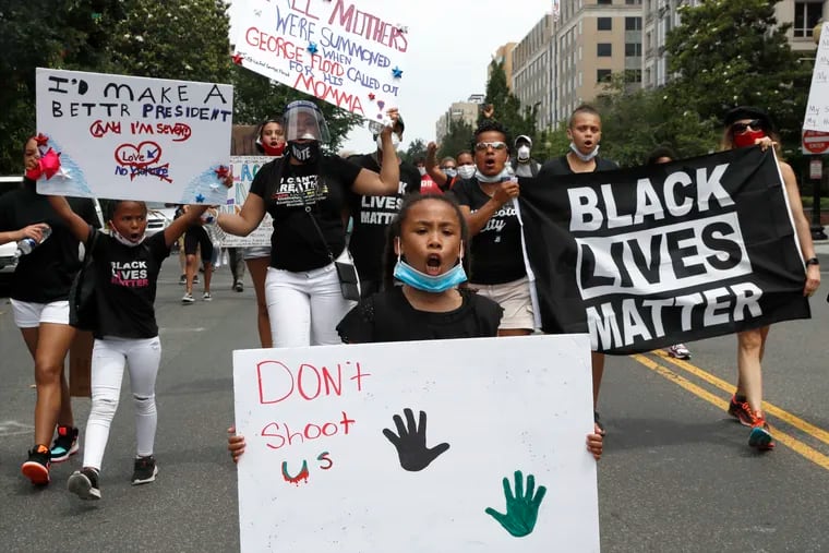 In this June 6 photo, demonstrators protest near the White House over the death of George Floyd, a black man who was in police custody in Minneapolis.
