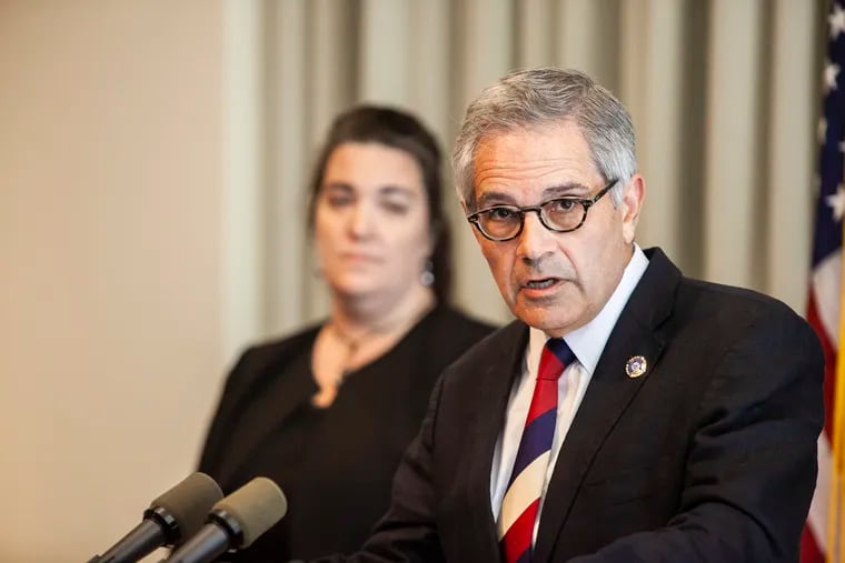 Philadelphia District Attorney Larry Krasner in 2018, as his office announced charges against former police officer Ryan Pownall. Pownall is now suing Krasner.