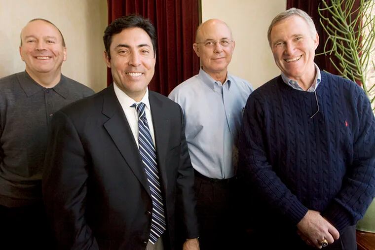 Phillies general manager Ruben Amaro Jr. (second from left) with his team of assistant GMs (from left): Scott Proefrock, Benny Looper and Chuck Lamar.