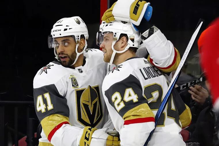 Vegas’ Pierre-Edouard Bellemare (41) celebrates his goal against the Carolina Hurricanes with teammate Oscar Lindberg. The former Flyer has contributed to the expansion team’s stunning success.