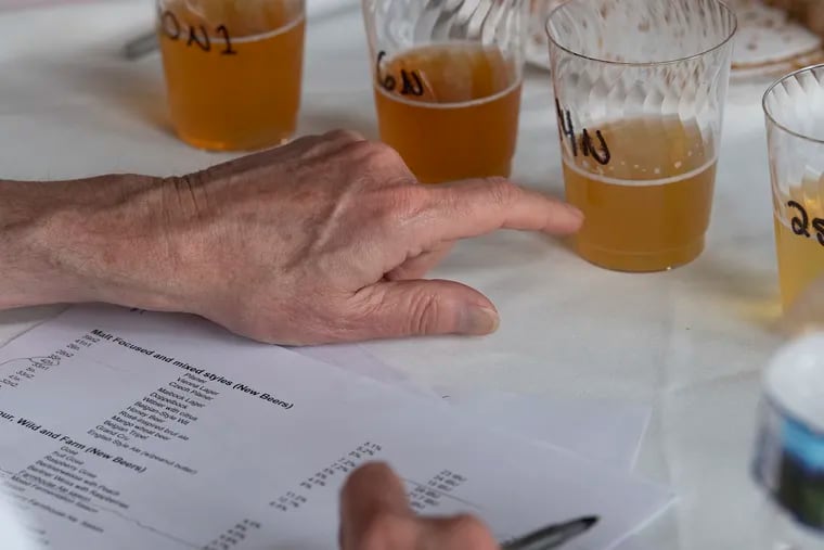 Rick Nichols judges beers during the 10th annual Brewvitational.