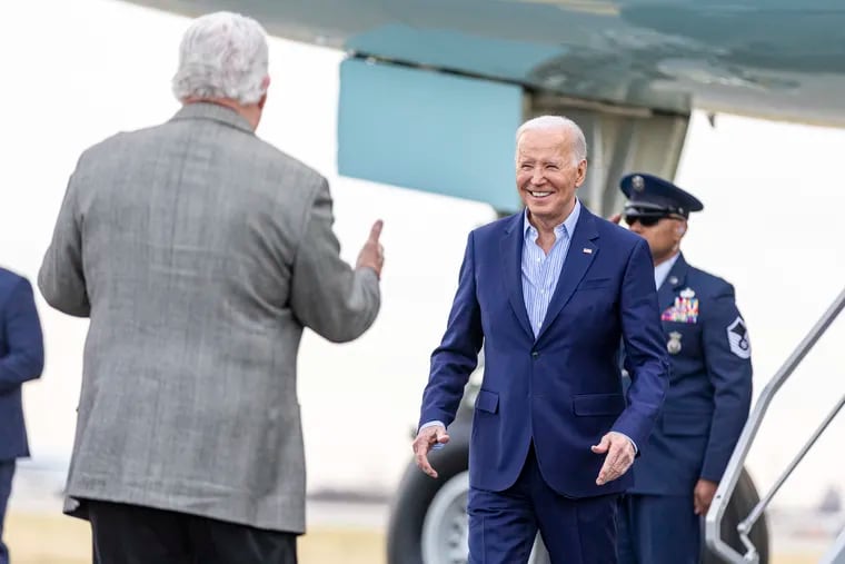 President Joe Biden is greeted by party chair Bob Brady at the Philadelphia International Airport in March.