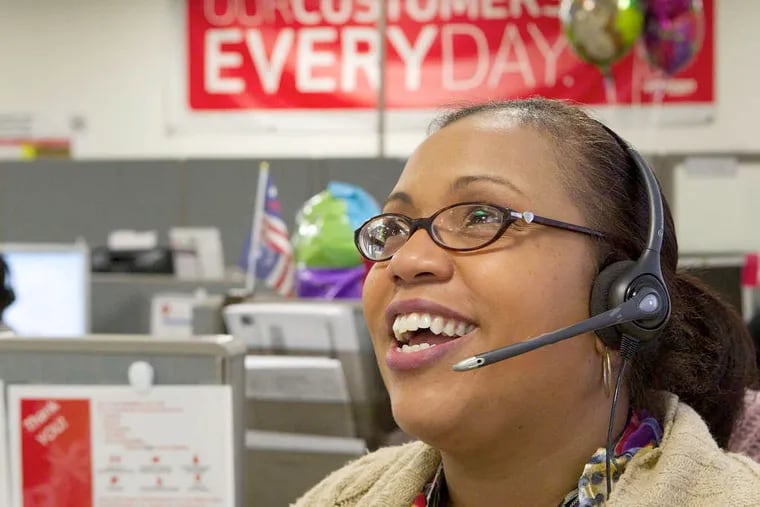 Verizon's Nichole Nikolic helps a customer at its Race Street call center. Verizon rates higher than the average telecom giant in solving customer problems, but it also acknowledges there is room for improvement.