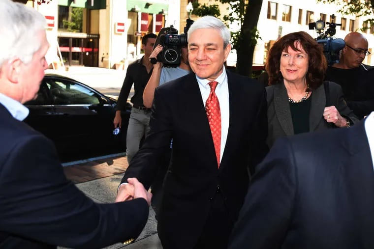 Former Penn State President Graham Spanier second from left, arrives for his sentencing at the Dauphin County Courthouse Friday June 2, 2017 in Harrisburg, Pa.
