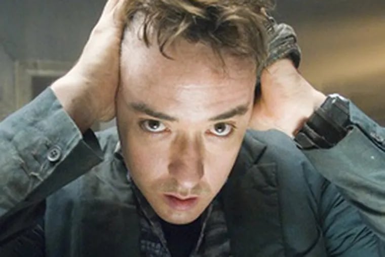 John Cusack plays travel writer Mike Enslin in Mikael H&#0229;fstr&#0246;m&#0039;s &quot;1408,&quot; a movie based on a Stephen King short story.
