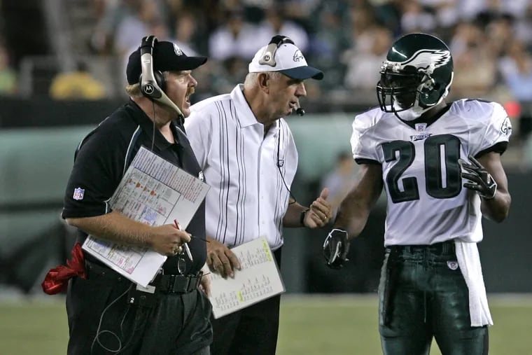 Brian Dawkins played for two defensive coordinators in his time with the Eagles: Jim Johnson (pictured above with Andy Reid in 2005) and Emmitt Thomas.