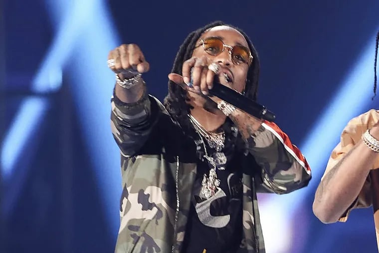 In this Saturday, Sept. 23, 2017, file photo, Quavo performs with Travis Scott and DJ Khaled at the 2017 iHeartRadio Music.