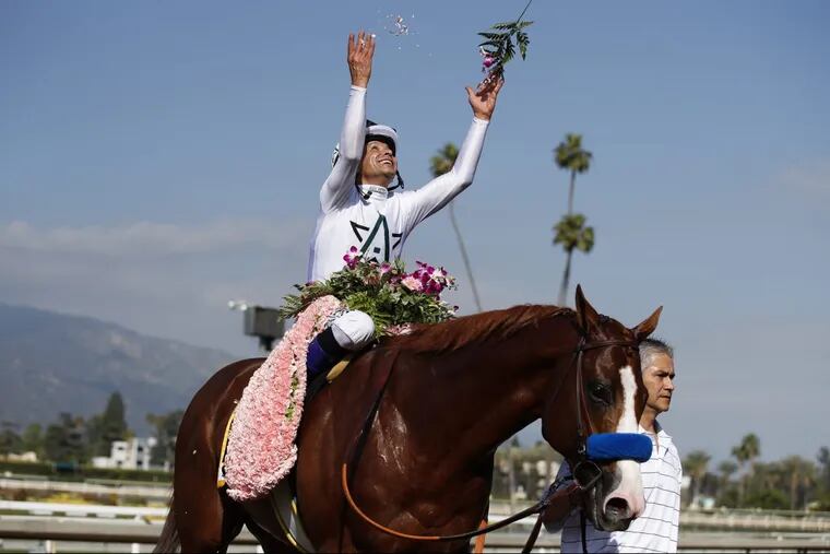 Mike Smith celebrates after riding Justify to victory in the Santa Anita Derby. He’s the early favorite to strike a similar pose after Saturday’s Kentucky Derby.