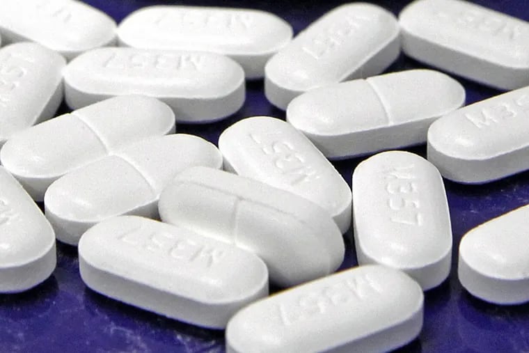 Hydrocodone-acetaminophen pills, also known as Vicodin, arranged for a photo at a pharmacy in Vermont.