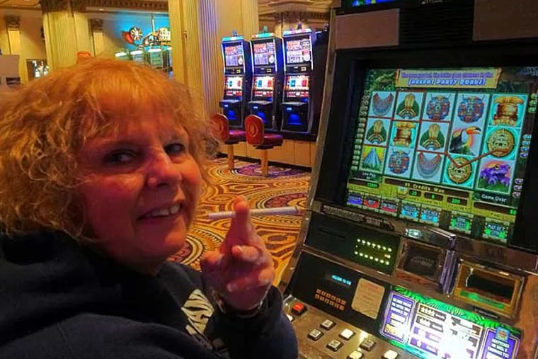 "It's an adrenalin rush," says Christine LaCoste of Bayville,
N.J., shown at Caesars. "Even when I stopped smoking … I'd
go to a casino and buy cigarettes." SUZETTE PARMLEY / Staff
