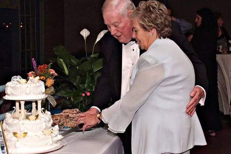 Couple: JACK LEES and PAT PIERSON
Bride & Groom cut the cake at wedding reception. Photo credit: Photography by J. William Citino III
