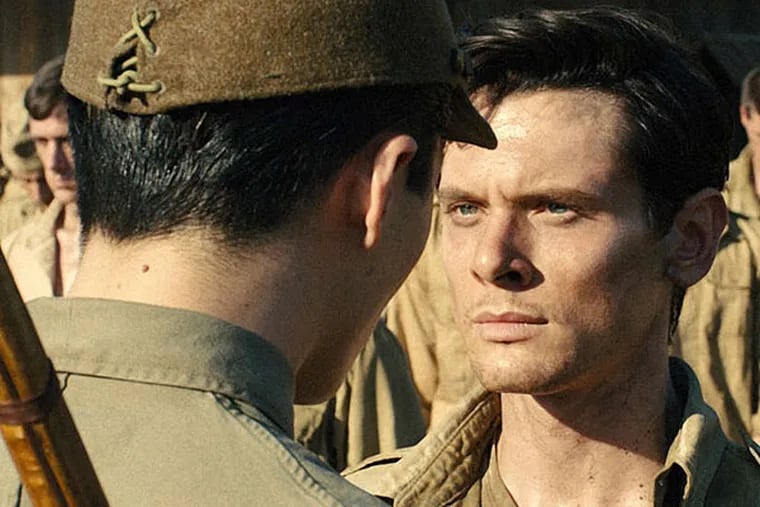Jack O'Connell as Olympic runner and war hero Louis Zamperini in &quot;Unbroken.&quot;