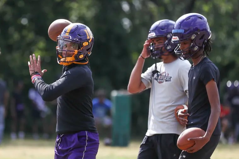 Roman Catholic quarterback Semaj Beals throwing the ball during practice at the Friends of River Field in Philadelphia on June 13.