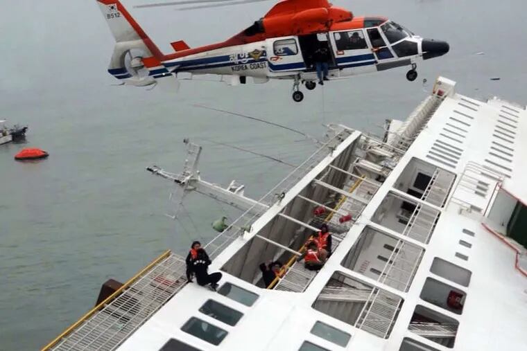 Passengers from the Sewol are rescued by a South Korean coast guard helicopter as the ferry sinks. A different video shows the captain being treated onshore after allegedly landing on one of the first rescue boats.